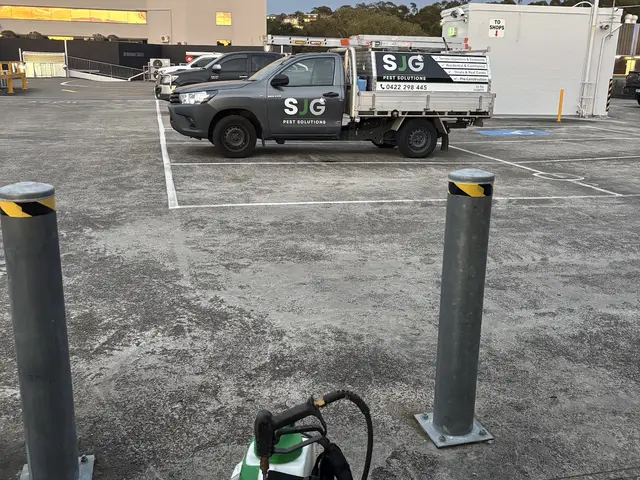 SJG Pest Solutions ute and backpack sprayer at a commercial car park treatment