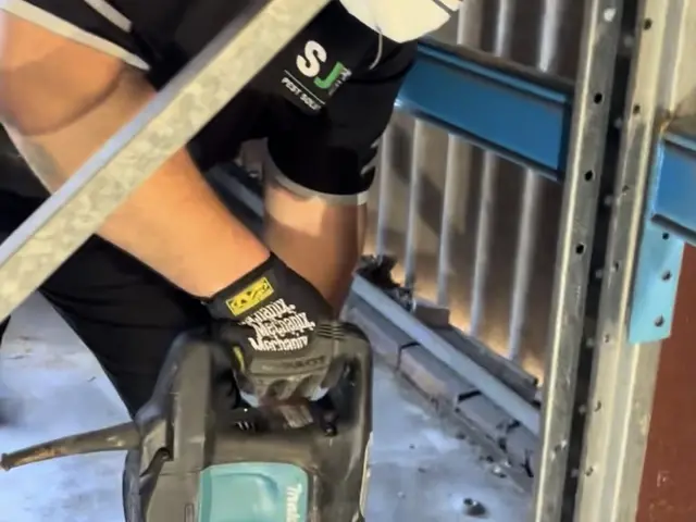 SJG technician treating steel framing at a commercial site