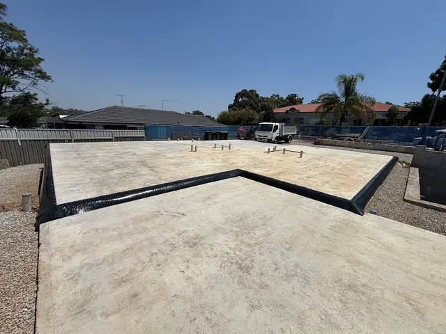 Termite membrane sealed to the edge of a freshly poured slab