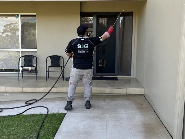 SJG technician applying a perimeter treatment around a Sydney home