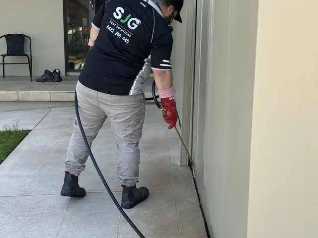 SJG technician treating the perimeter of a strata unit