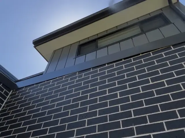 SJG technician treating the exterior eaves of a multi-storey strata building